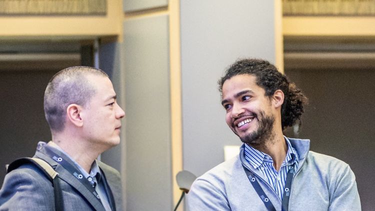 People interacting at Cancer Grand Challenges event