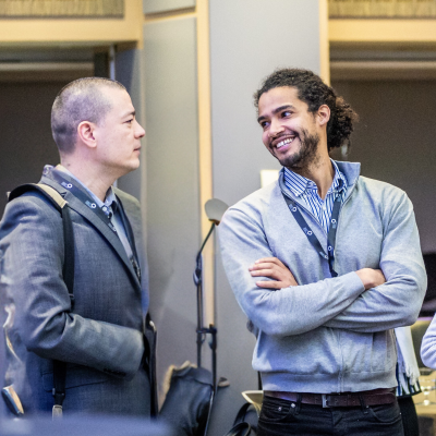 People interacting at Cancer Grand Challenges event