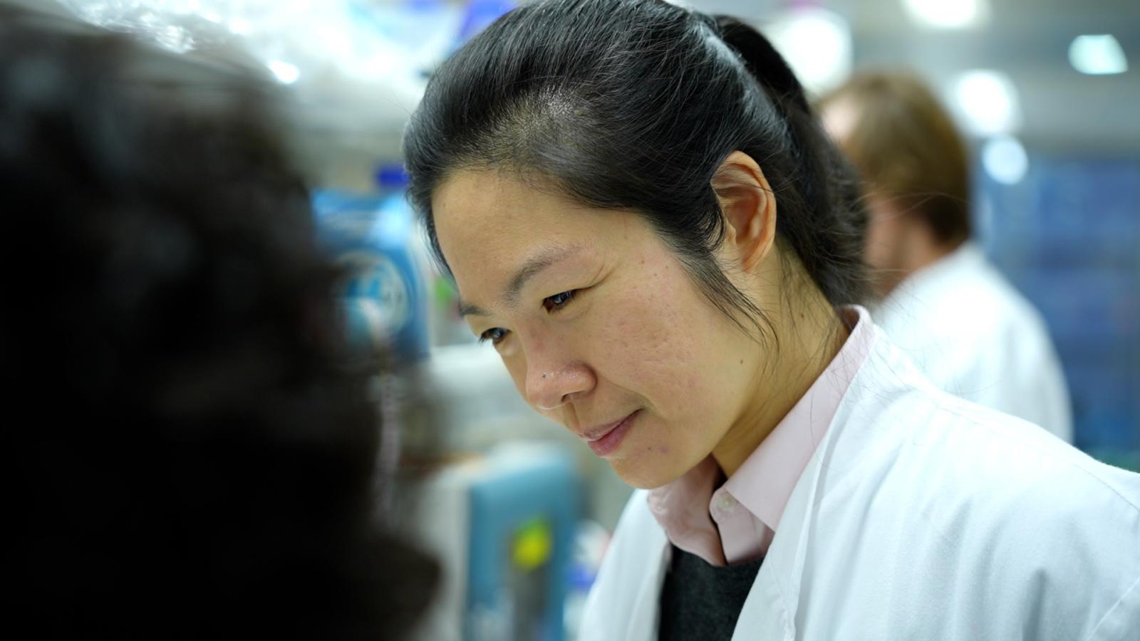 Photo of Leanne Li in a lab coat